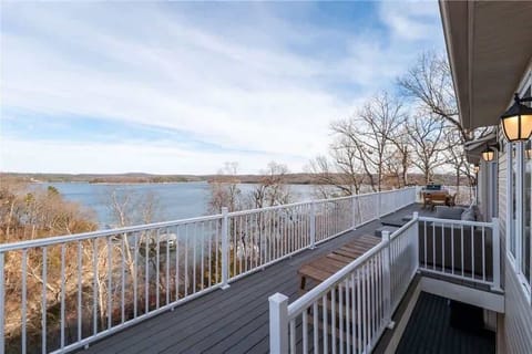 View from the deck walkway overlooking Beaver Lake and the wooded shoreline—perfect for sunsets and morning coffee.