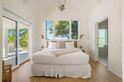 The Pool House's bedroom features a king bed, access to the pool area and an ensuite bathroom. (Bedroom 4)