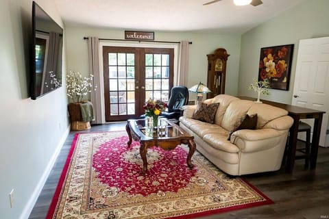Main Living Area with 75" TV and bar style seating, couch, Ekornes Recliner