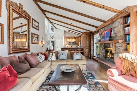 Spacious living room with vaulted ceilings, stunning views, fireplace and smart TV