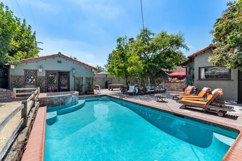 Large backyard w Guest House Entertainment Room, Hot Tub and Pool.