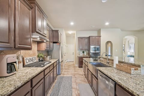 Fully stocked kitchen with stainless steel appliances
