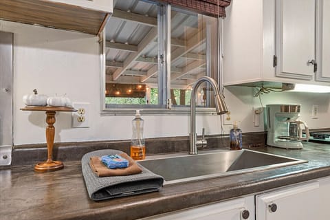 Kitchen sink with drip coffee maker nearby.  Locally roasted Sorbenots coffee complimentary.