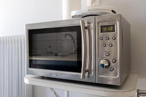 Modern microwave and appliances for quick, easy cooking during your stay.
