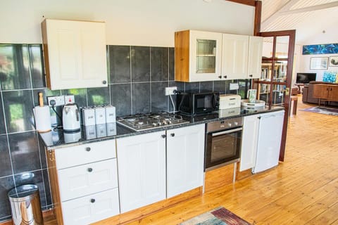 kitchen with matching cupboard units and appliances