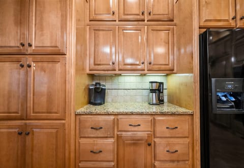 Coffee station and ample storage in this well-equipped kitchen.