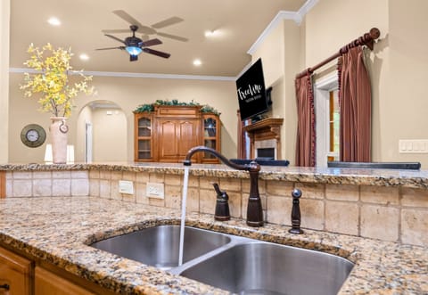 Large kitchen sink and view into living area.