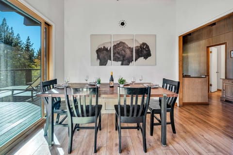 Dining area: Main floor, table seating for 6, 3 barstools, patio access