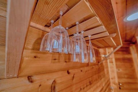 Wine glass rack: Wall-mounted cedar rack with hanging wine glasses—perfect for après-ski evenings or relaxing with a view