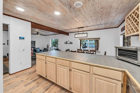 Kitchen: Main floor, drip coffee maker, French press, waffle maker, cooking utensils, tableware