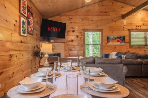 Enjoy a show on the Smart TV in the living room while sitting at the dining table.