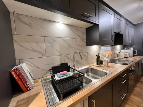 Everything you need for your break in this stylish kitchen. Including, kettle/toaster/dishwasher/microwave.