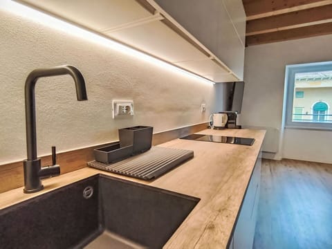 Wood, Flooring, Countertop, Interior Design, Kitchen, Plumbing Fixture, Tap, Ceiling, Floor, Sink