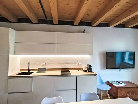 Flooring, Furniture, Interior Design, Kitchen, Countertop, Wood, Floor, Kitchen Appliance, Cabinetry, Lighting