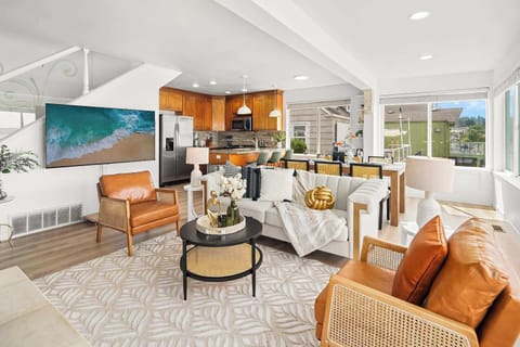 Modern kitchen and living space with an airy design, seamlessly blending comfort with coastal charm.