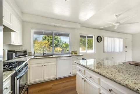 Fully stocked kitchen and dining table for four