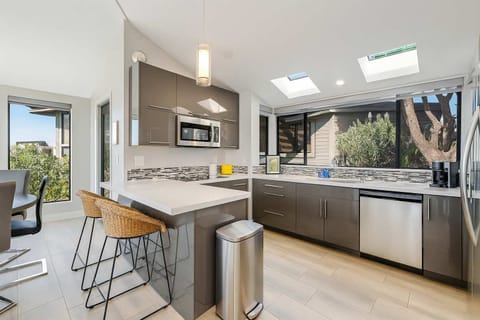 Sleek countertops, skylights, and everything you need to cook in comfort.