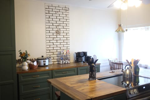 You enter the front door into the fully-stocked kitchen.