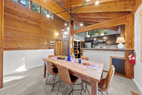 Open dining and kitchen area with warm wood accents.