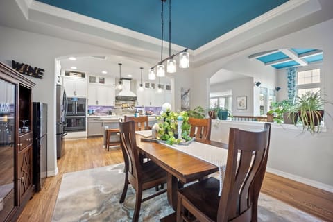 A formal dining space with extends to 8 with a full wine fridge by the side.