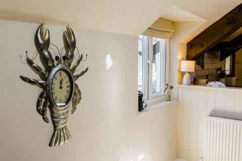 Close up shot of a novelty clock on the wall.