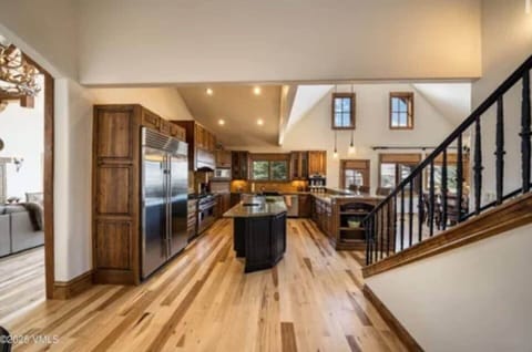 Full kitchen with all the amenities. Wolf stove and oven with exhaust. True chef’s kitchen. With ample space for entertaining and the family to gather around the kitchen.