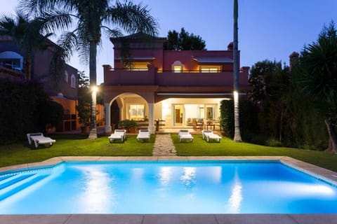 Illuminated terrace, garden and heated pool with adjacent shower and up to 22 sunbed and pool towels. First floor terrace with sun beds and table for 4 guests.