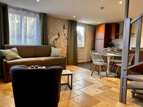 Spacious living room with reading corner, decorated in authentic Norman style.