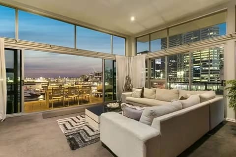 Relax in the spacious living room, large windows, and modern decor