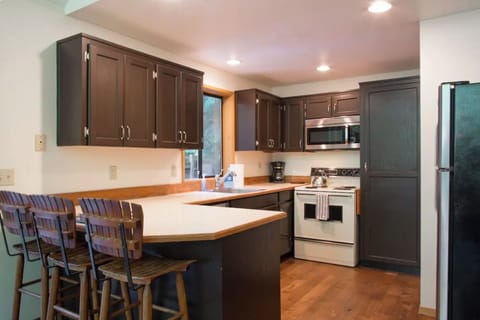 Kitchen is fully stocked with cooking supplies 