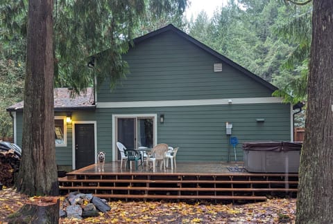 Enjoy the old growth wooded backyard with a hot tub