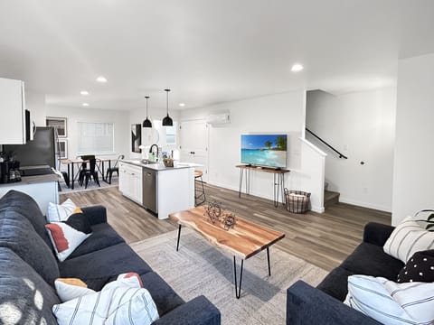 Step into your modern open-concept retreat where sleek design meets comfort. Sink into the plush sofas while enjoying the smart tv, creating the perfect backdrop for relaxation after your adventures.