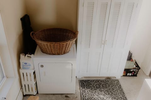 Large laundry room with both washer & dryer