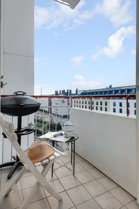 Savor grilled meals with a view from this balcony BBQ setup.