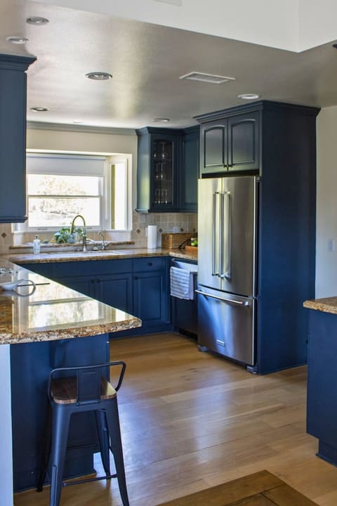 Fully equipped kitchen with modern appliances, ample counter space, and all the essentials for preparing meals, making it the perfect spot for cooking.