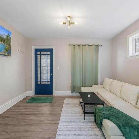 living room features a comfortable sofa, modern décor, and a smart TV—perfect for relaxing after a day of sightseeing.