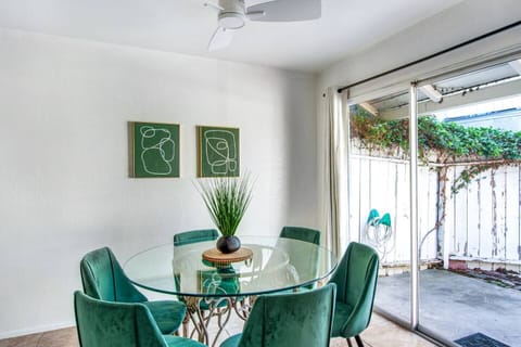 Bright dining area with seating for four and access to the patio.
