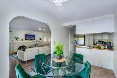 Stylish dining area with seating for six, open to the living room and kitchen for easy entertaining.