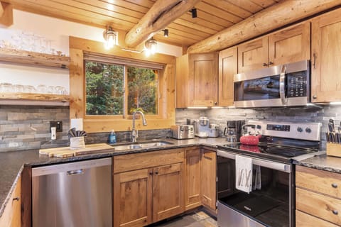 Kitchen (main floor): Drip coffee maker, Keurig, Crockpot, blender, kettle, cooking utensils, tableware