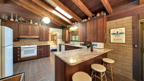 Kitchen features beautiful granite counters with bar seating