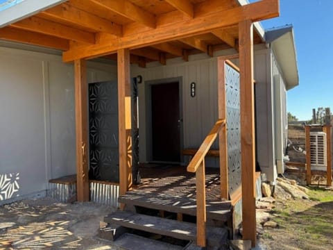 Front porch features privacy and wind screens