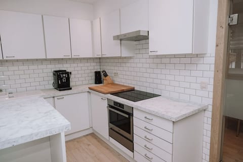 Kitchen with hair chairs and modern facilities