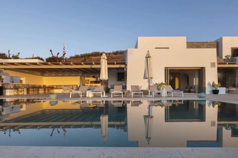 Palmyra's graceful façade reflected in the pool.