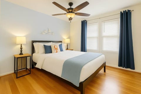 Relax in this cozy queen bedroom, ideal for two guests. Enjoy a restful night’s sleep with extra blankets and pillows conveniently stored in the closet. Unwind after a day at the beach with a smart TV for movie nights and all the comforts of home.