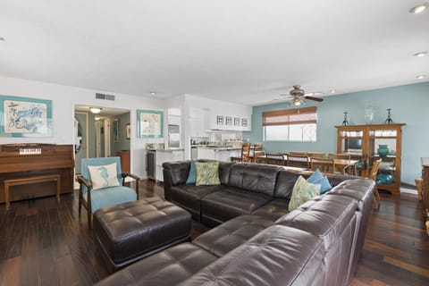 The main living area includes an upright piano for music lovers to enjoy