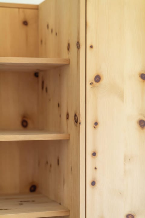 Classic Wooden Wardrobe Space Convenient wardrobe with plenty of storage for your clothes and luggage, adding a touch of classic Alpine charm.