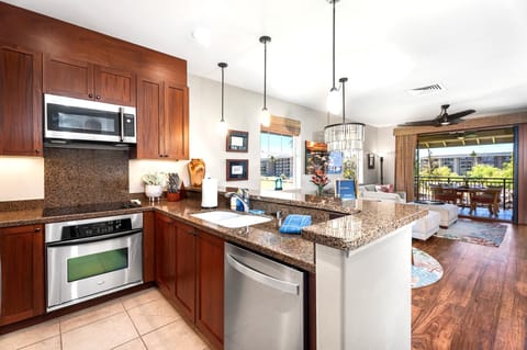 Granite counters and stainless steel appliances make the fully equipped kitchen a joy for preparing island favorites.