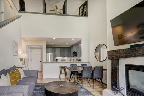 The open living and dining space pairs rustic textures with modern design, creating the perfect alpine retreat for family and friends.