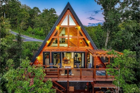 Relax on decks with BBQ, fire pit, hot tub, lounging area, putting & cornhole.