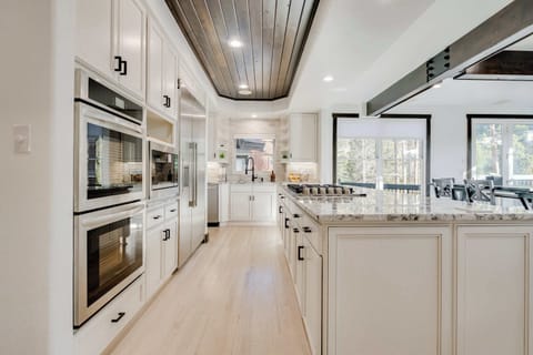 The primary kitchen with double oven, gas range, microwave and coffee bar. Plus plenty of small appliances for those family meals!